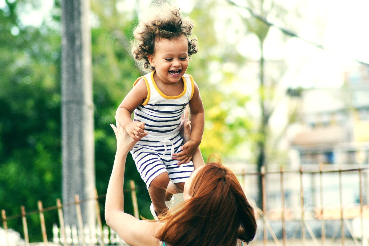 happy child playing with mom