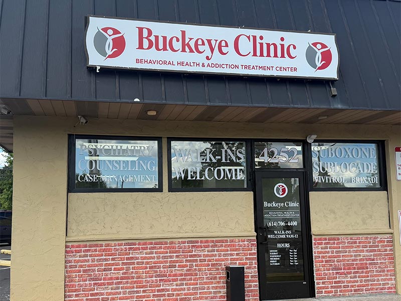 Exterior Entrance of Buckeye Clinic Showing a Glass Door with Contact Details in East Columbus, OH
